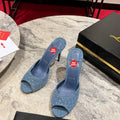 Denim high-heeled mules with rhinestone embellishments; 10cm heel.