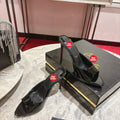 Black pointed-toe patent leather high-heeled mules, 10cm heel.