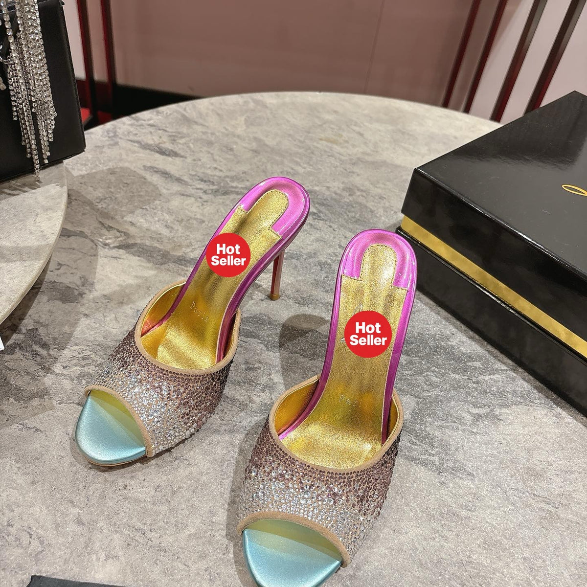 Peep-toe high-heeled slides with colorful rhinestones; 10cm heel.