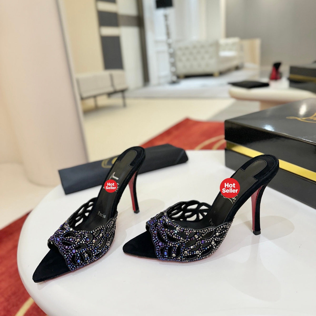 Black cutout high-heeled mules with all-over pavé crystals; 10cm heel.