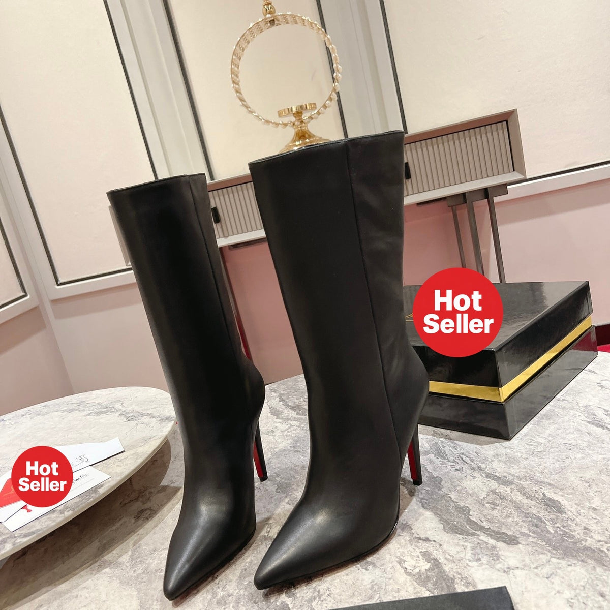Black leather mid-calf boots, 10cm heel.