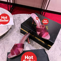 Peep-toe high-heeled slides with diamond embellishment; 8.5cm heel.