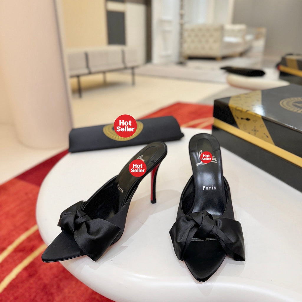 Black bow-detail high-heeled mules, 10cm heel.