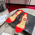 Red translucent high-heeled mules, 8.5cm heel.