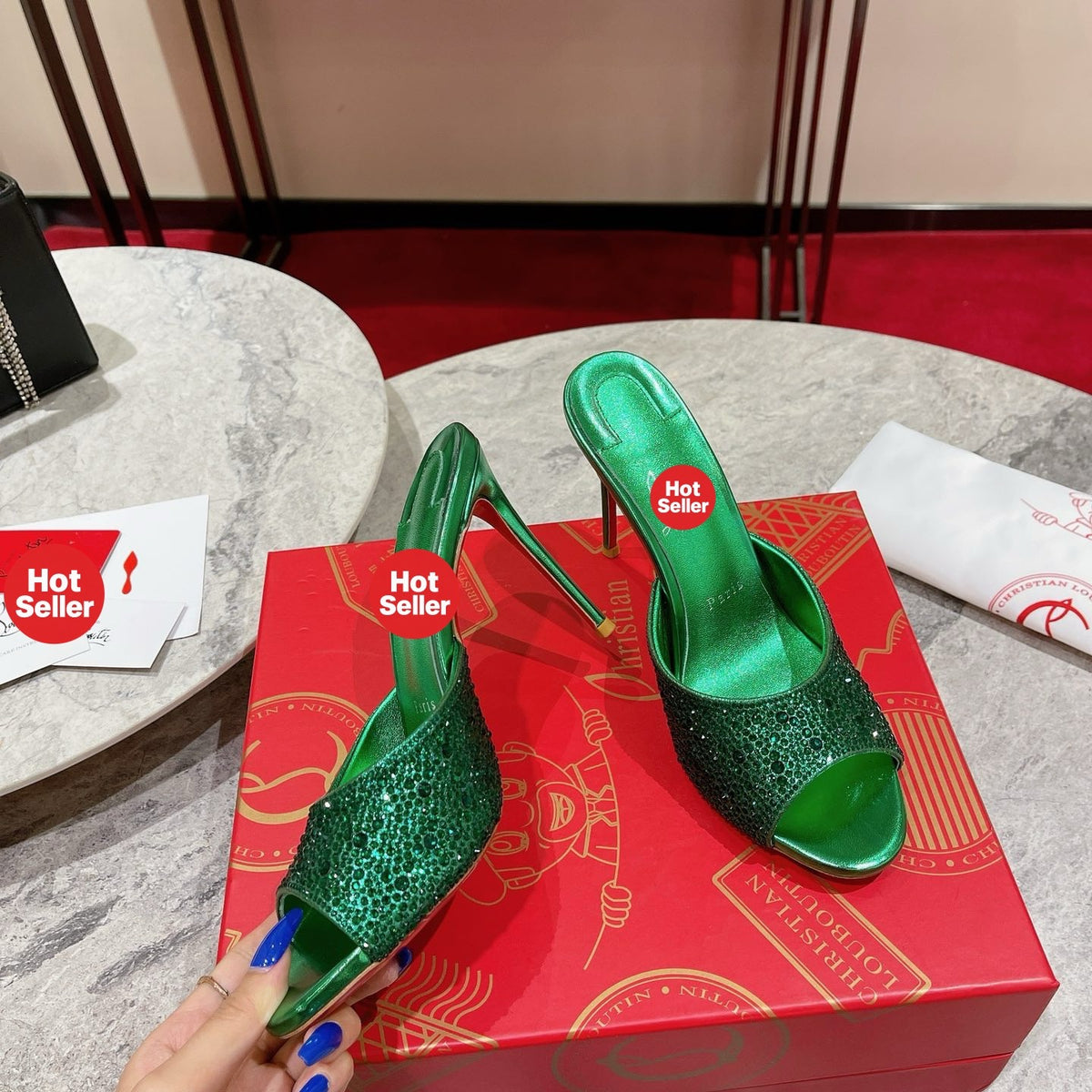 Green peep-toe high-heeled mules with rhinestone embellishment; 10cm heel.