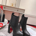 Black calfskin ankle boots with 13cm stiletto heels.