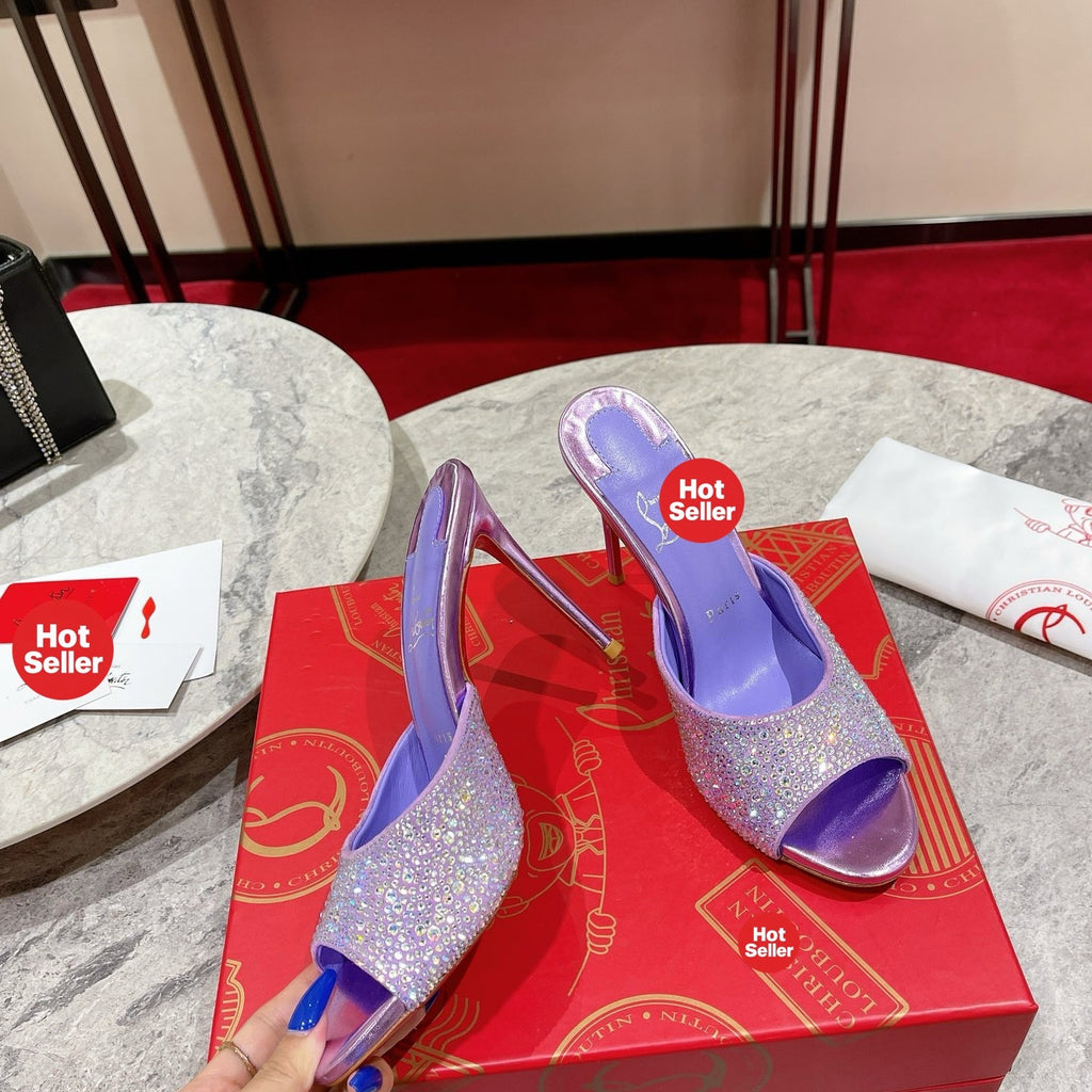 Purple peep-toe high-heeled mules with rhinestone embellishment; 10cm heel.
