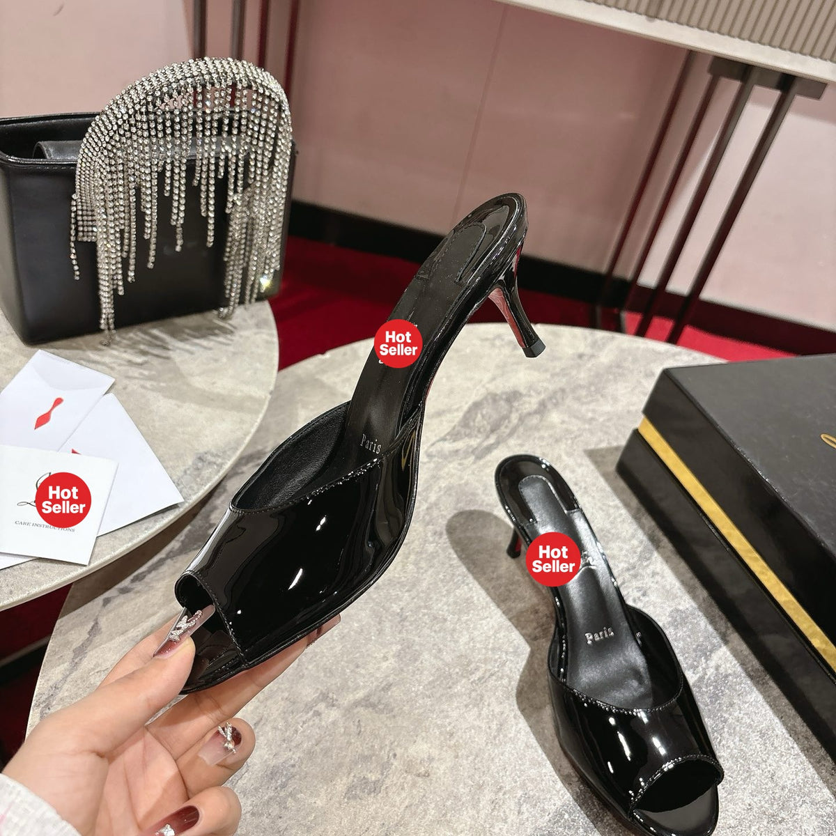 Black patent leather high-heeled mules, 8.5cm heel.