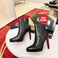 Black leather stiletto ankle boots, 12cm heel.
