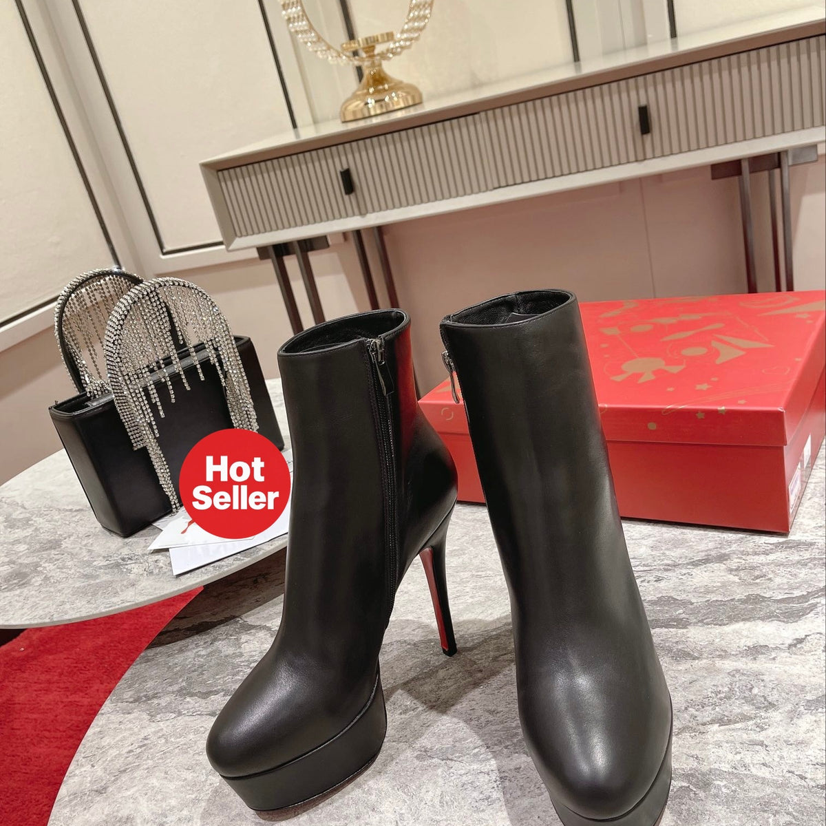 Black Nappa leather ankle boots featuring a soaring 12cm height. Heel: 13cm.