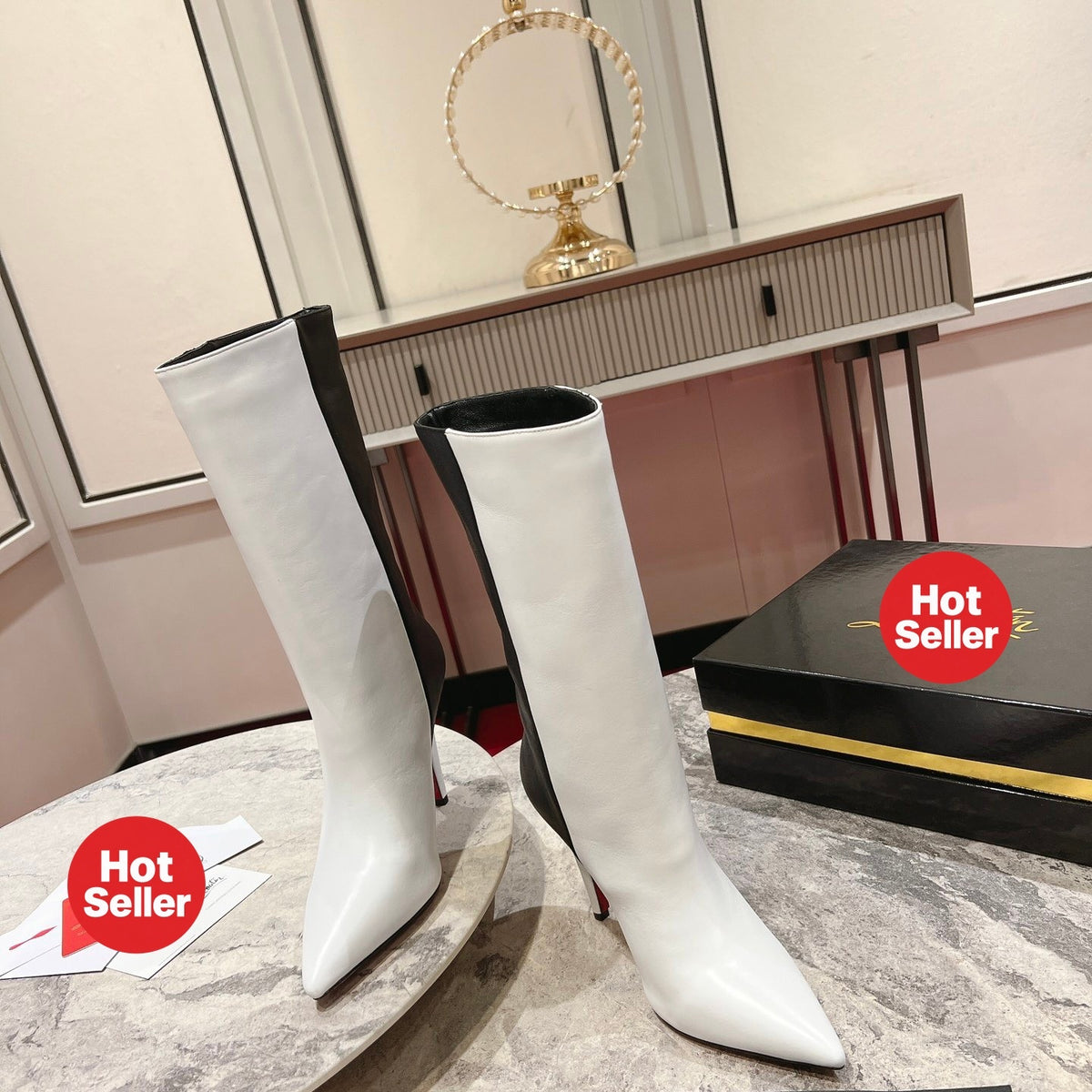 Paneled leather tall boots with a distinctive design; 10cm heel.
