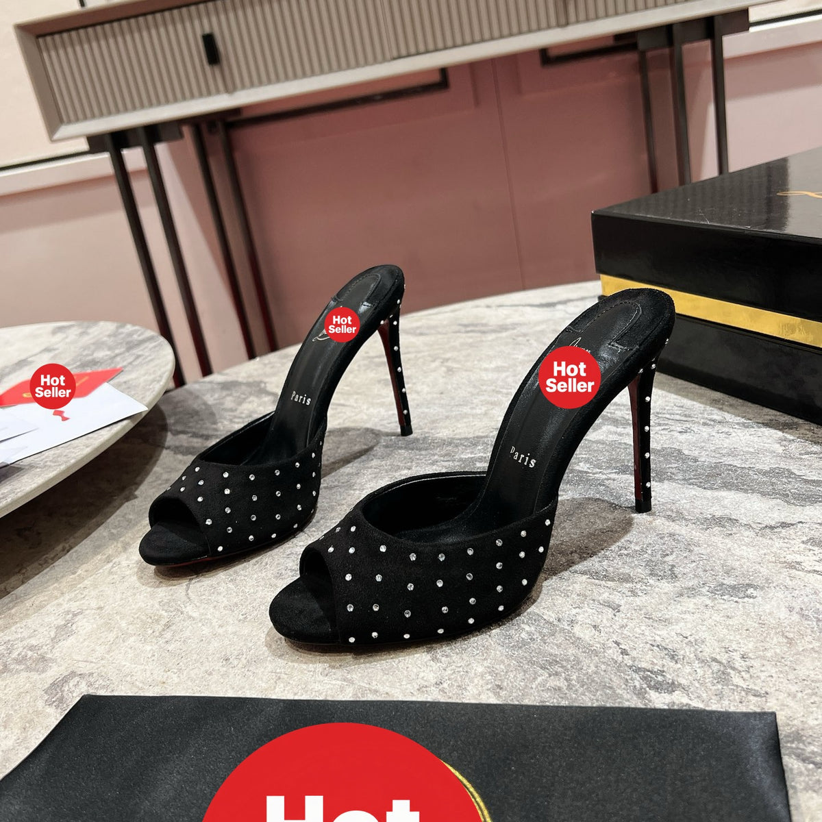 Black high-heeled mules with rhinestone accents, 10cm heel.