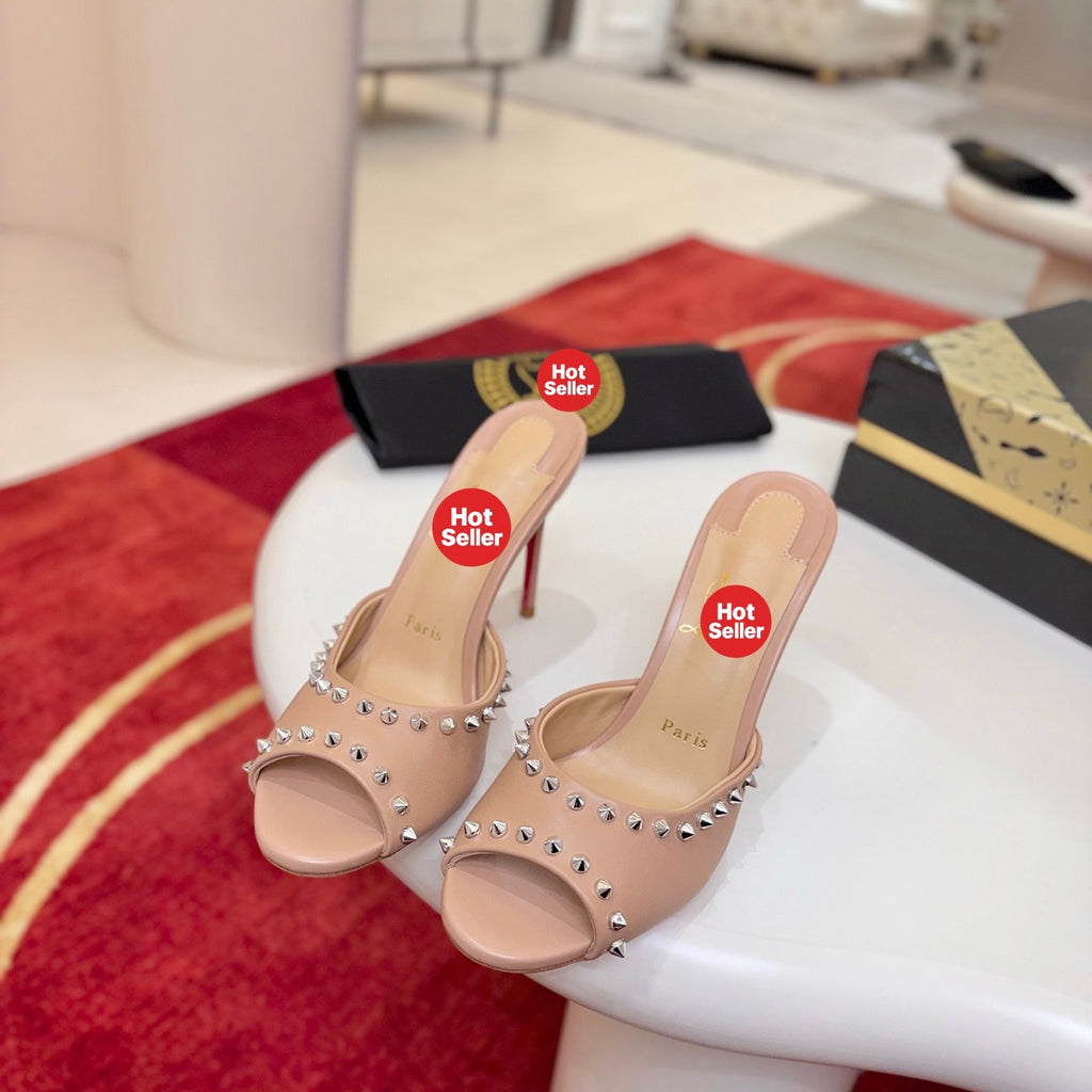 Apricot peep-toe high-heeled mules with stud detailing; 8.5cm heel.