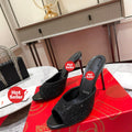 Black peep-toe high-heeled mules with rhinestone embellishment; 10cm heel.