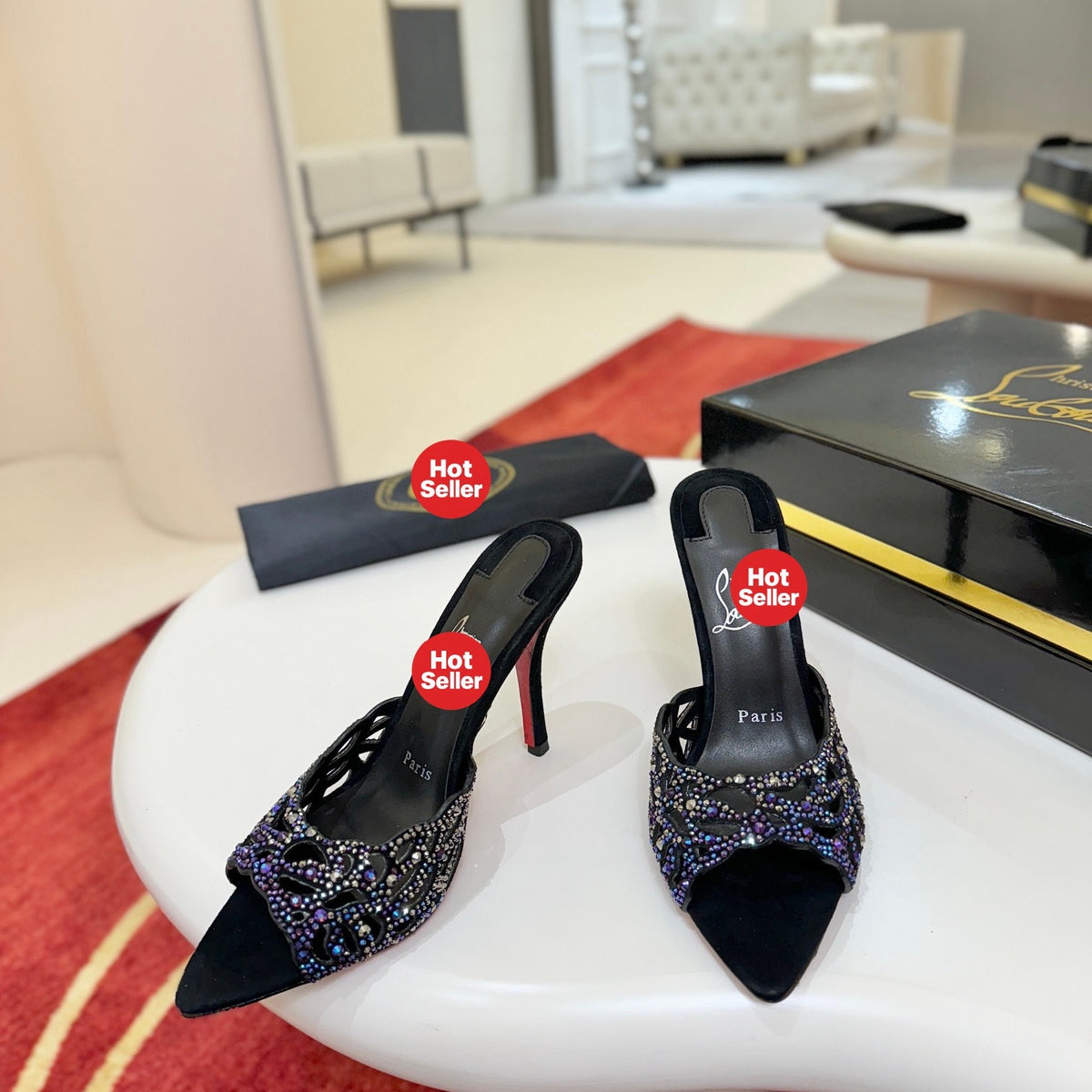 Black cutout high-heeled mules with all-over pavé crystals; 10cm heel.