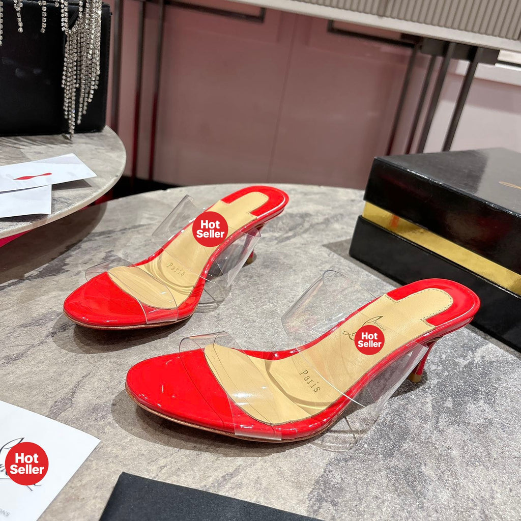 Red translucent high-heeled mules, 8.5cm heel.