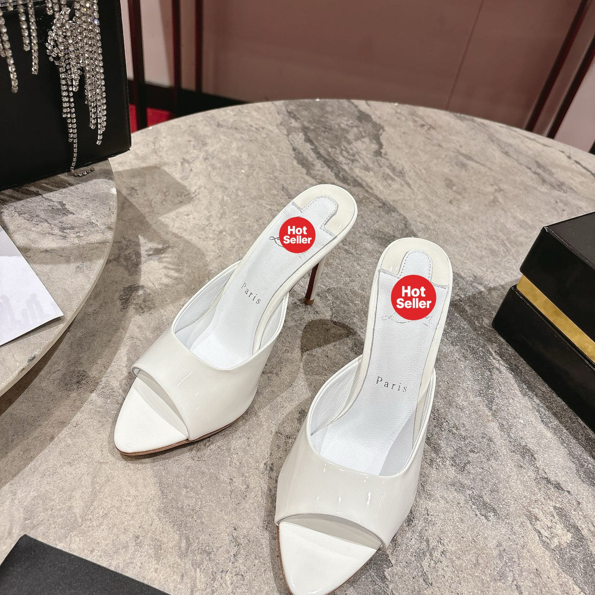 White pointed-toe patent leather high-heeled mules, 10cm heel.