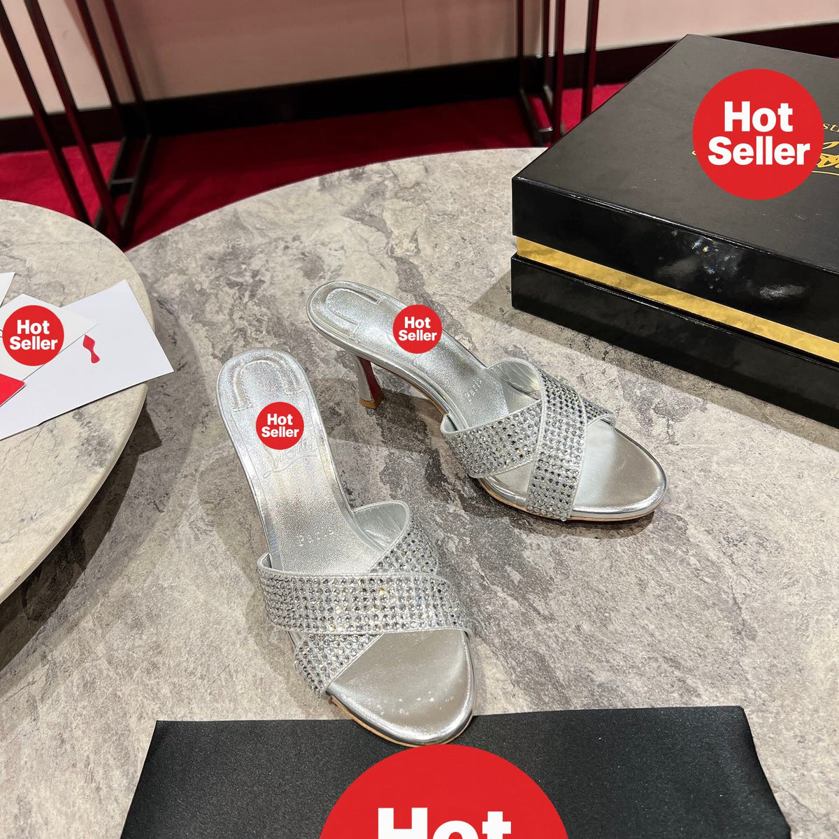 Silver peep-toe high-heeled mules with rhinestones; 8.5cm heel.