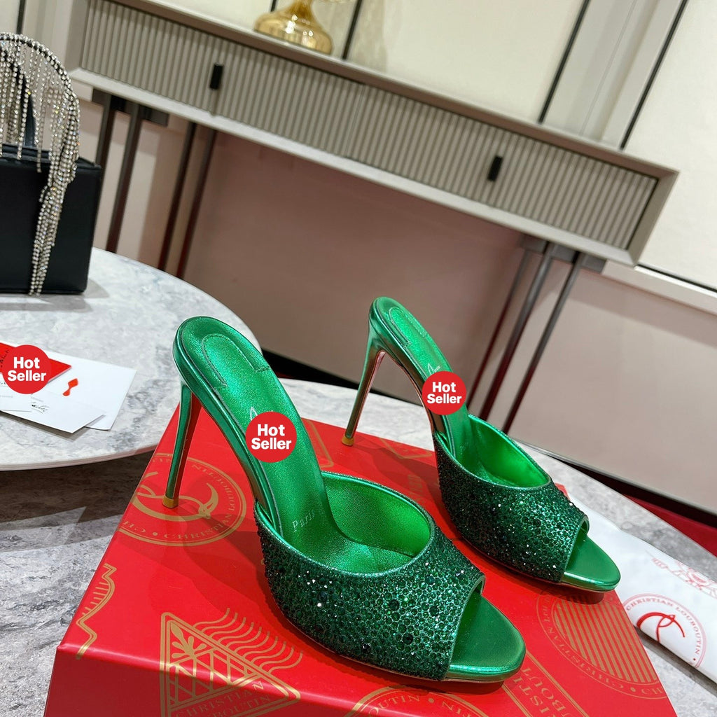 Green peep-toe high-heeled mules with rhinestone embellishment; 10cm heel.