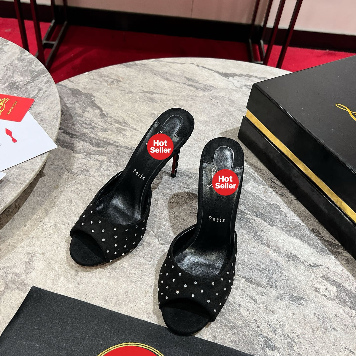 Black high-heeled mules with rhinestone accents, 10cm heel.