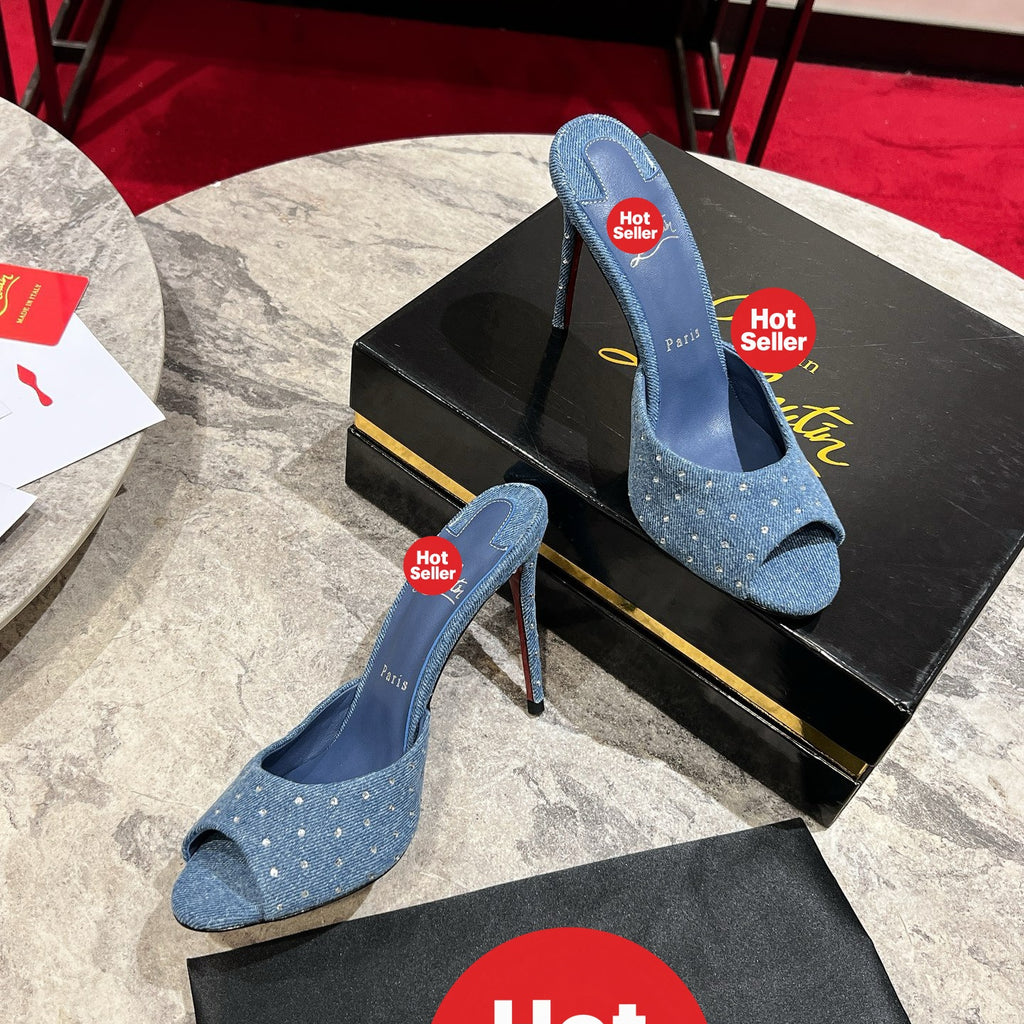 Denim high-heeled mules with rhinestone embellishments; 10cm heel.