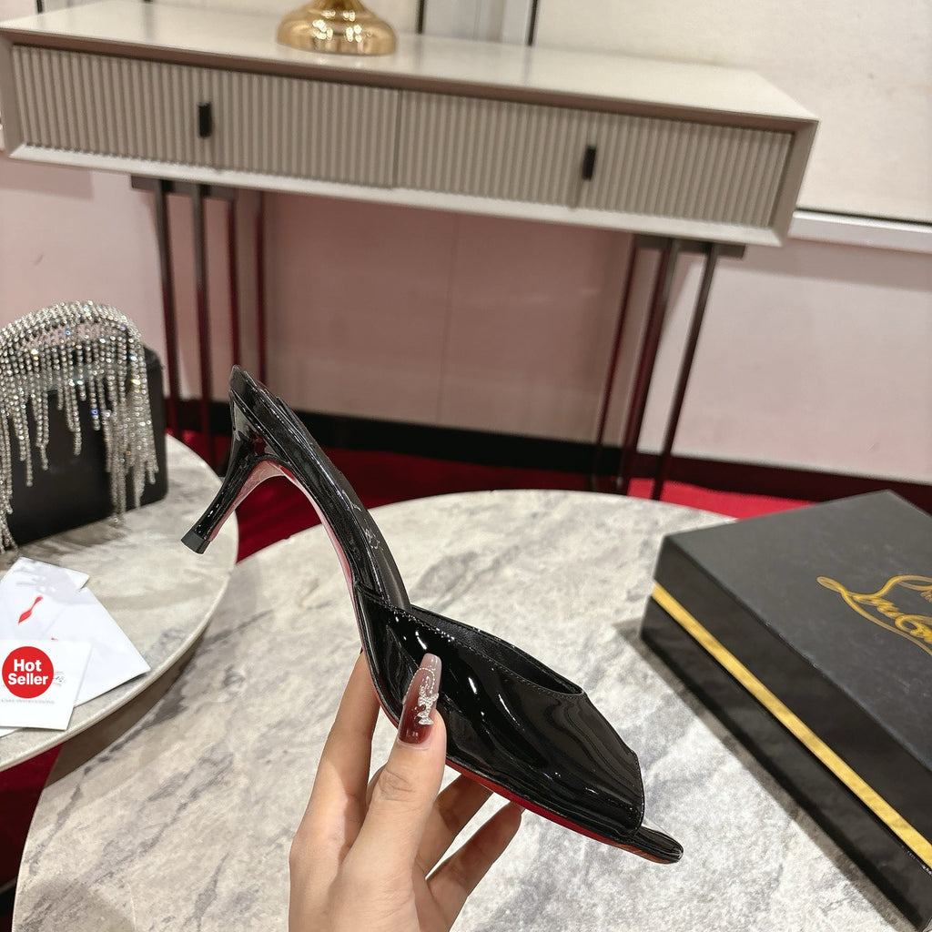 Black patent leather high-heeled mules, 8.5cm heel.