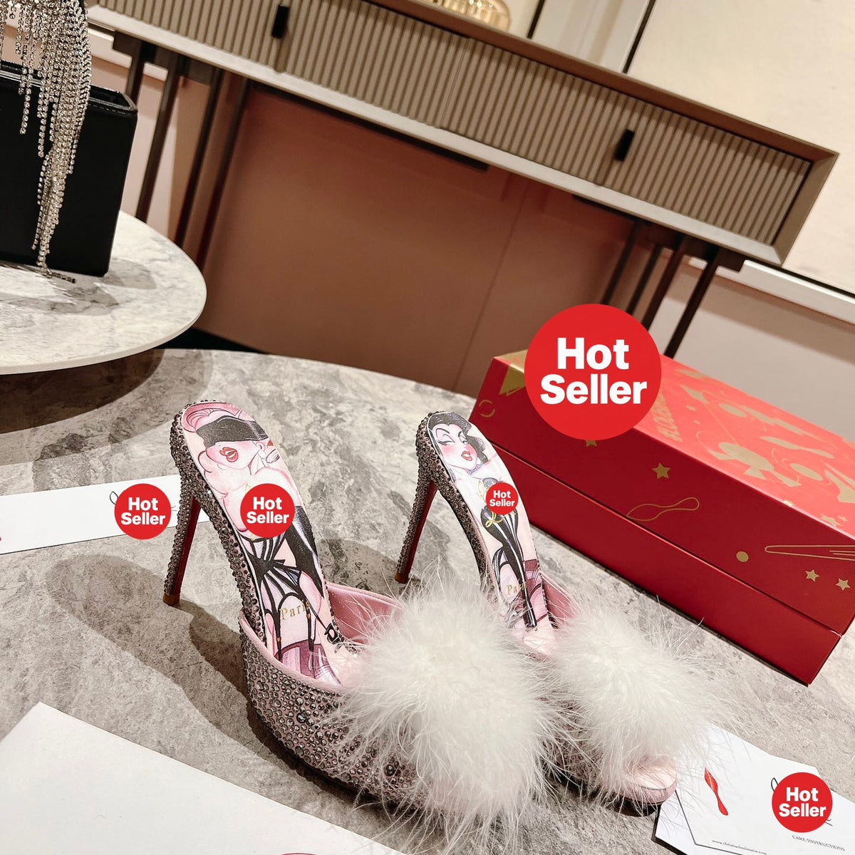 Stylish high-heeled mules with pom-poms; 10cm heel.