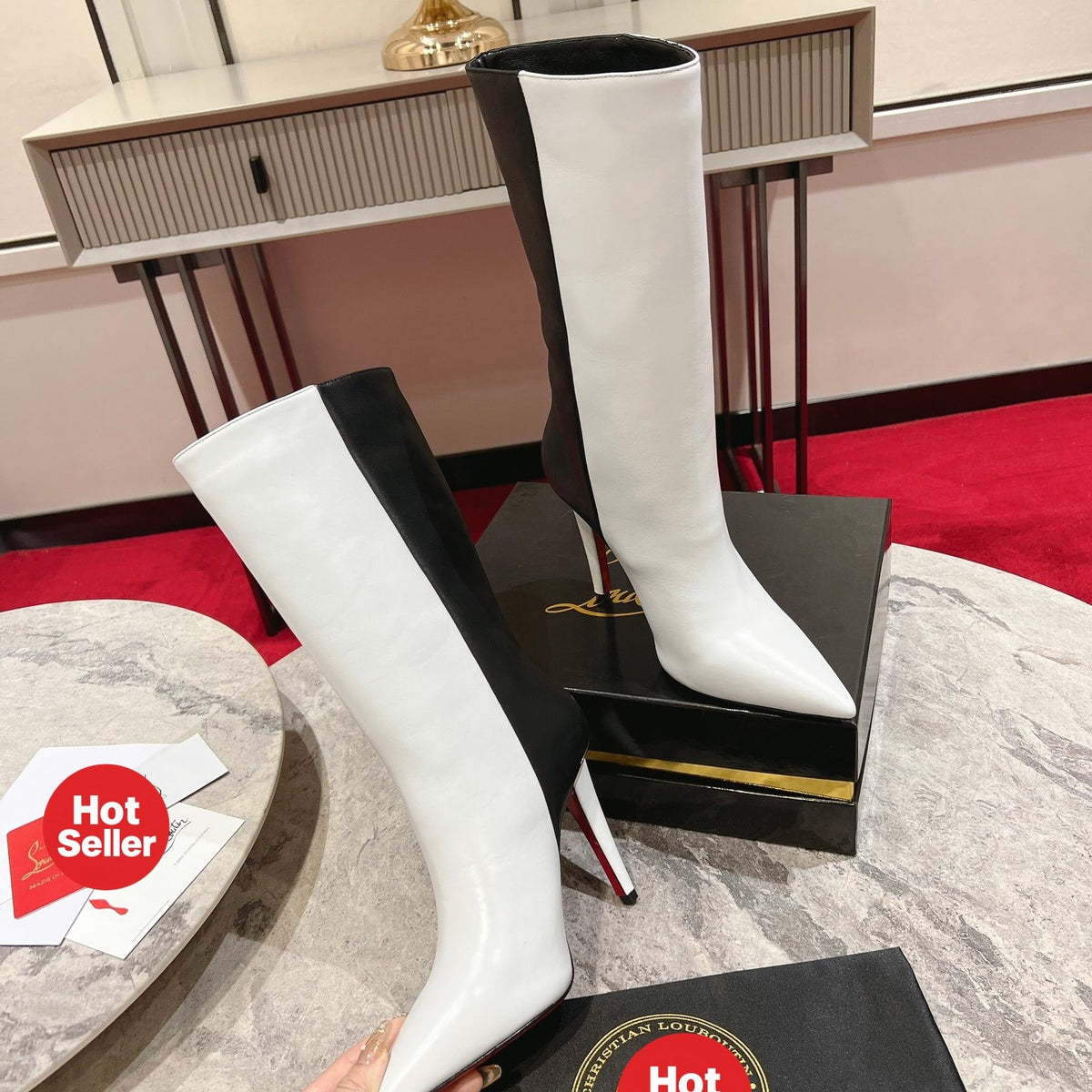Paneled leather tall boots with a distinctive design; 10cm heel.