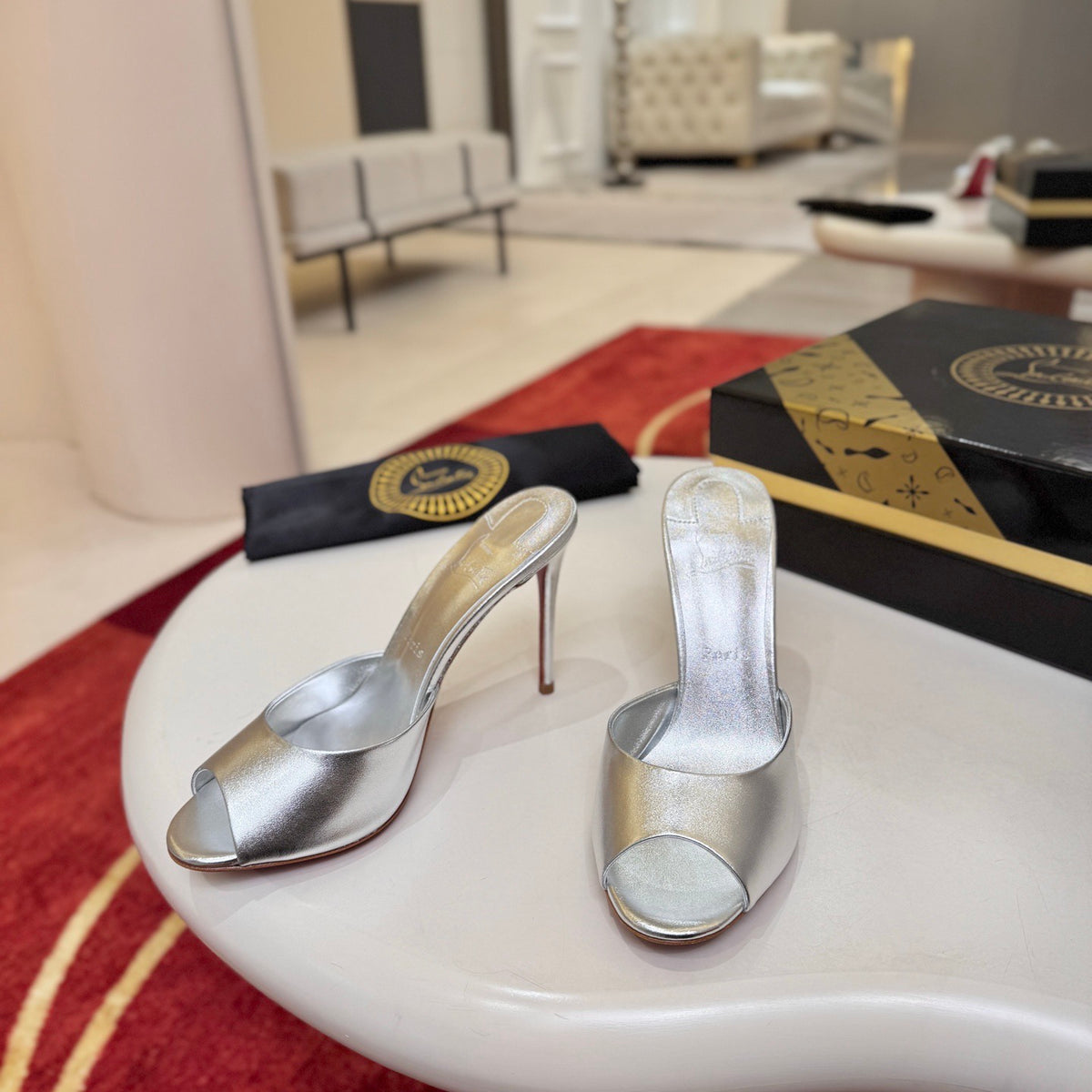 Silver peep-toe high-heeled mules, 10cm heel.