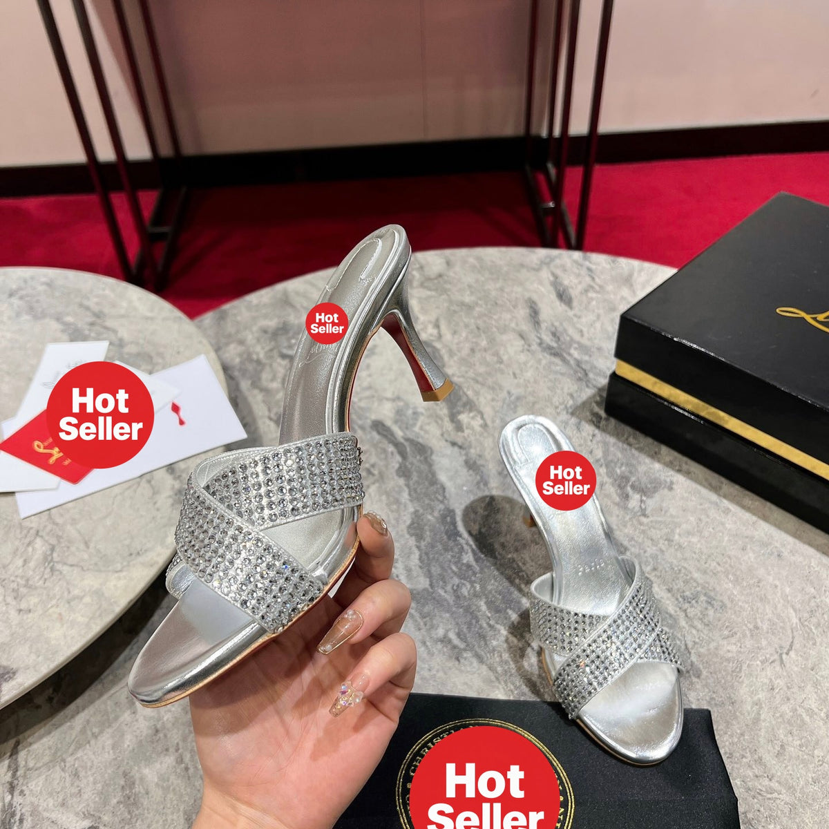 Silver peep-toe high-heeled mules with rhinestones; 8.5cm heel.