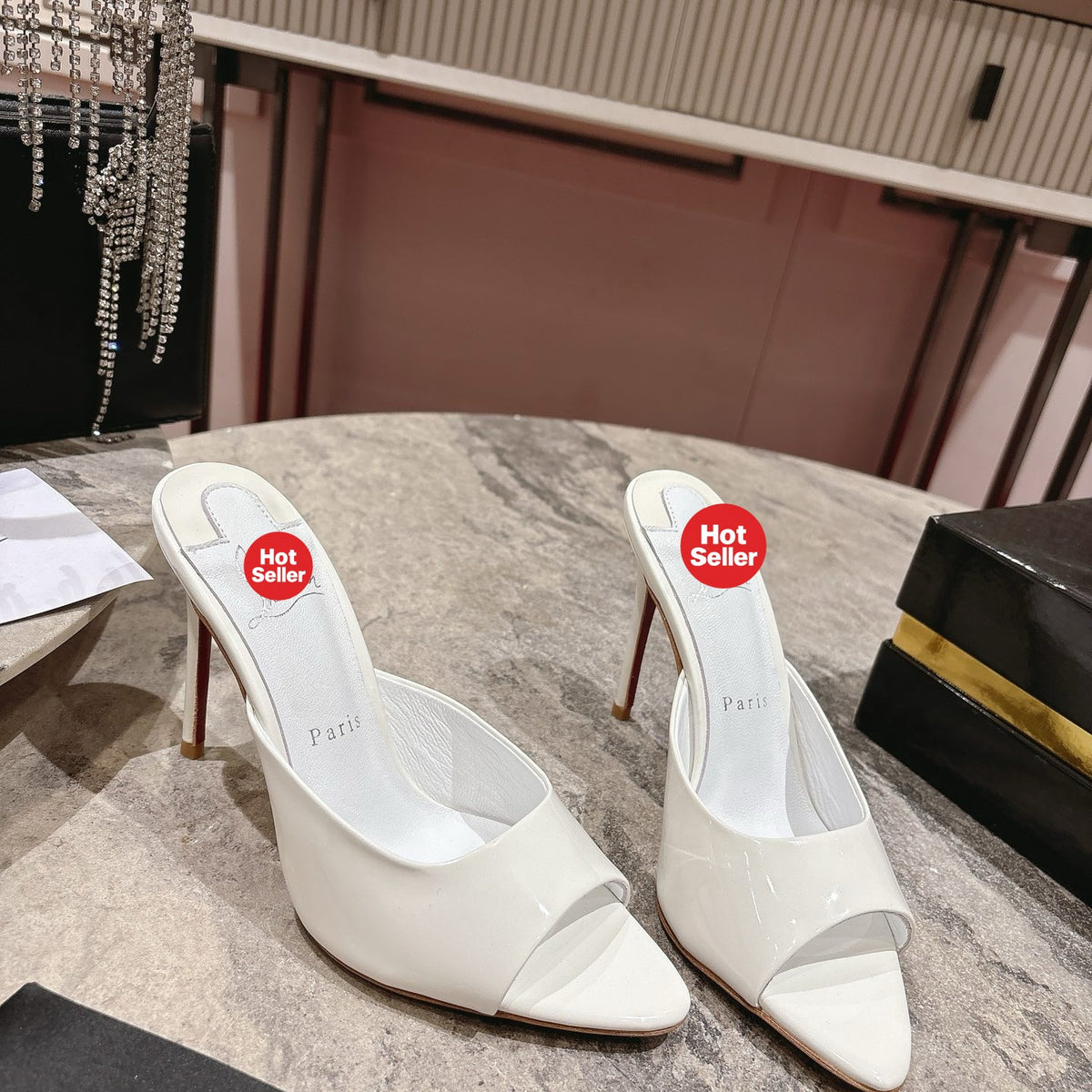 White pointed-toe patent leather high-heeled mules, 10cm heel.