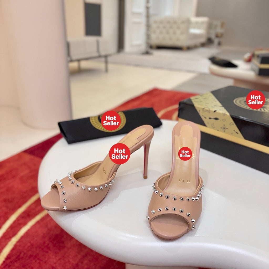 Apricot peep-toe high-heeled mules with stud detailing; 8.5cm heel.
