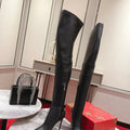 Sophisticated long boots, 10cm heel.