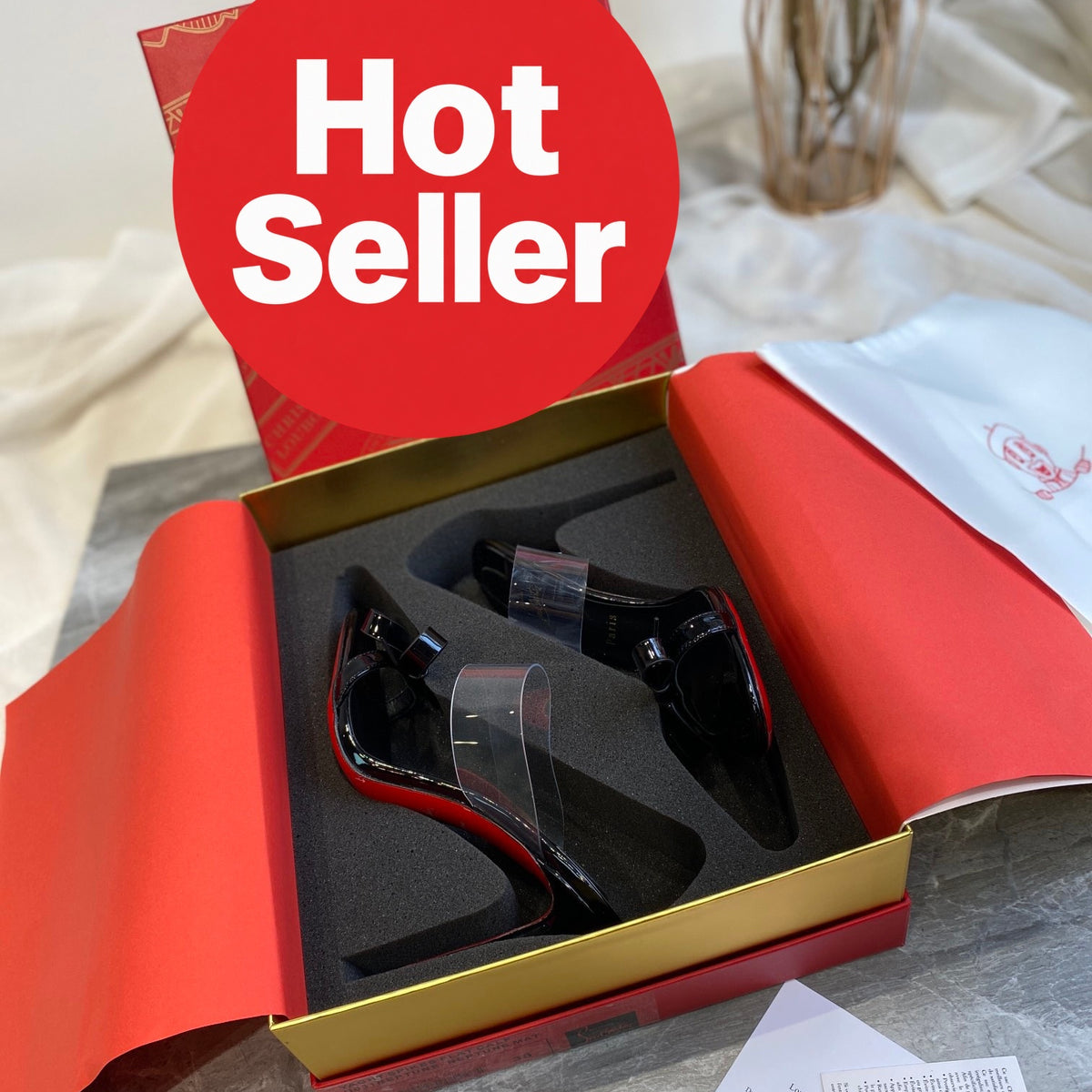 Black high-heeled mules with butterfly-shaped transparent detail; 10cm heel.