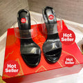 Black high-heeled mules with transparent detailing; 10cm heel.