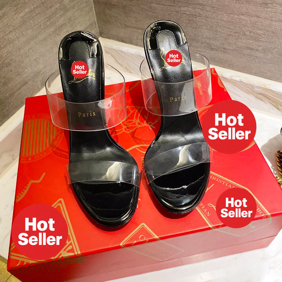 Black high-heeled mules with transparent detailing; 10cm heel.