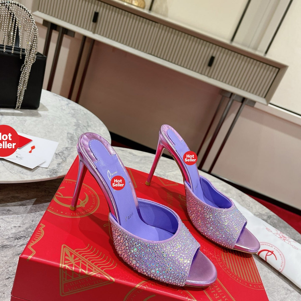 Purple peep-toe high-heeled mules with rhinestone embellishment; 10cm heel.