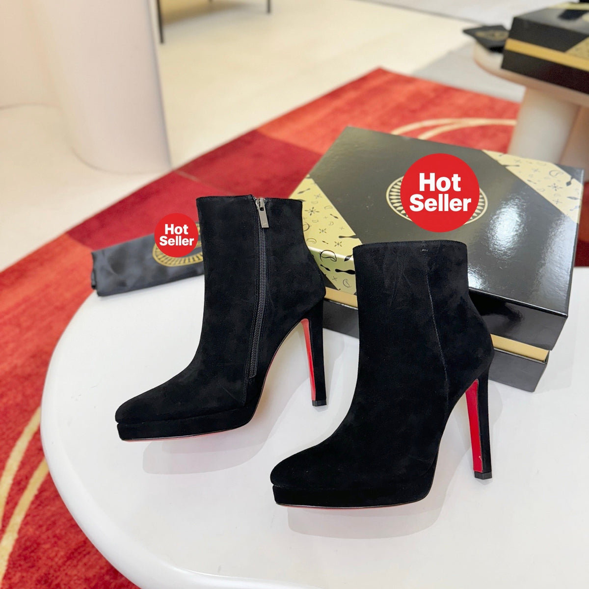 Black suede stiletto ankle boots, 12cm heel.