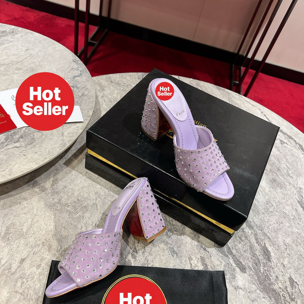 Chunky-heeled mules with purple rhinestone embellishment; heel height: 8.5cm.