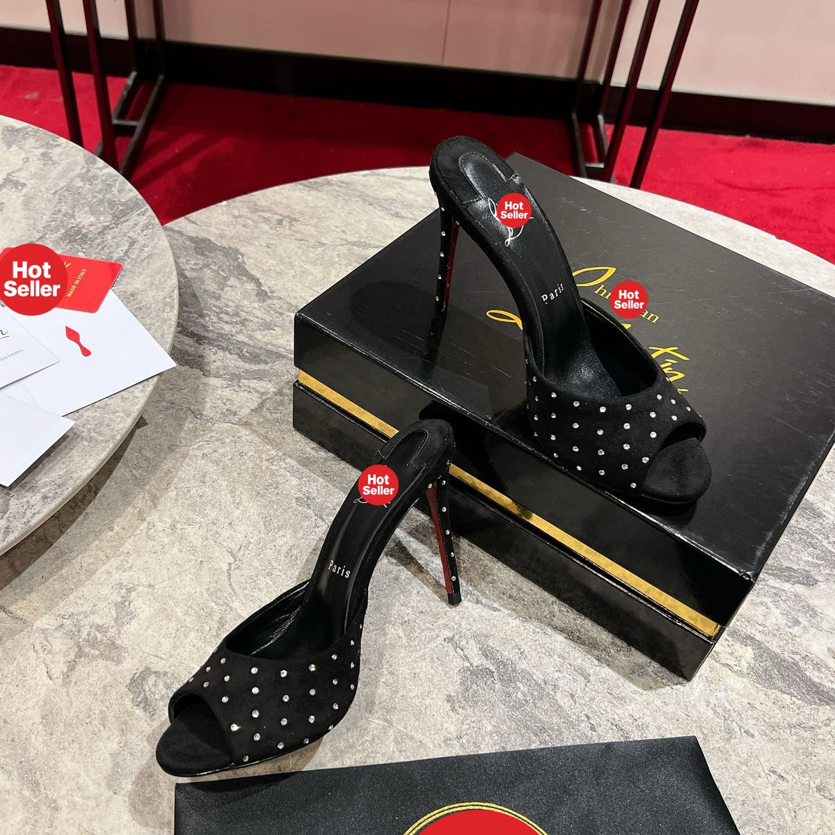 Black high-heeled mules with rhinestone accents, 10cm heel.