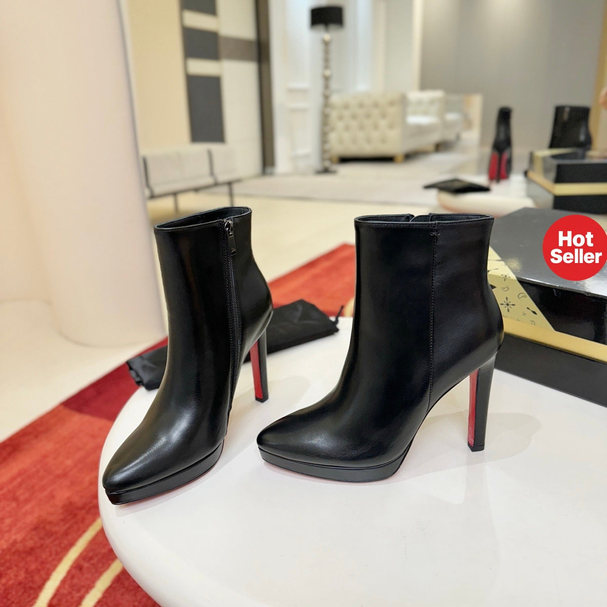 Black leather stiletto ankle boots, 12cm heel.