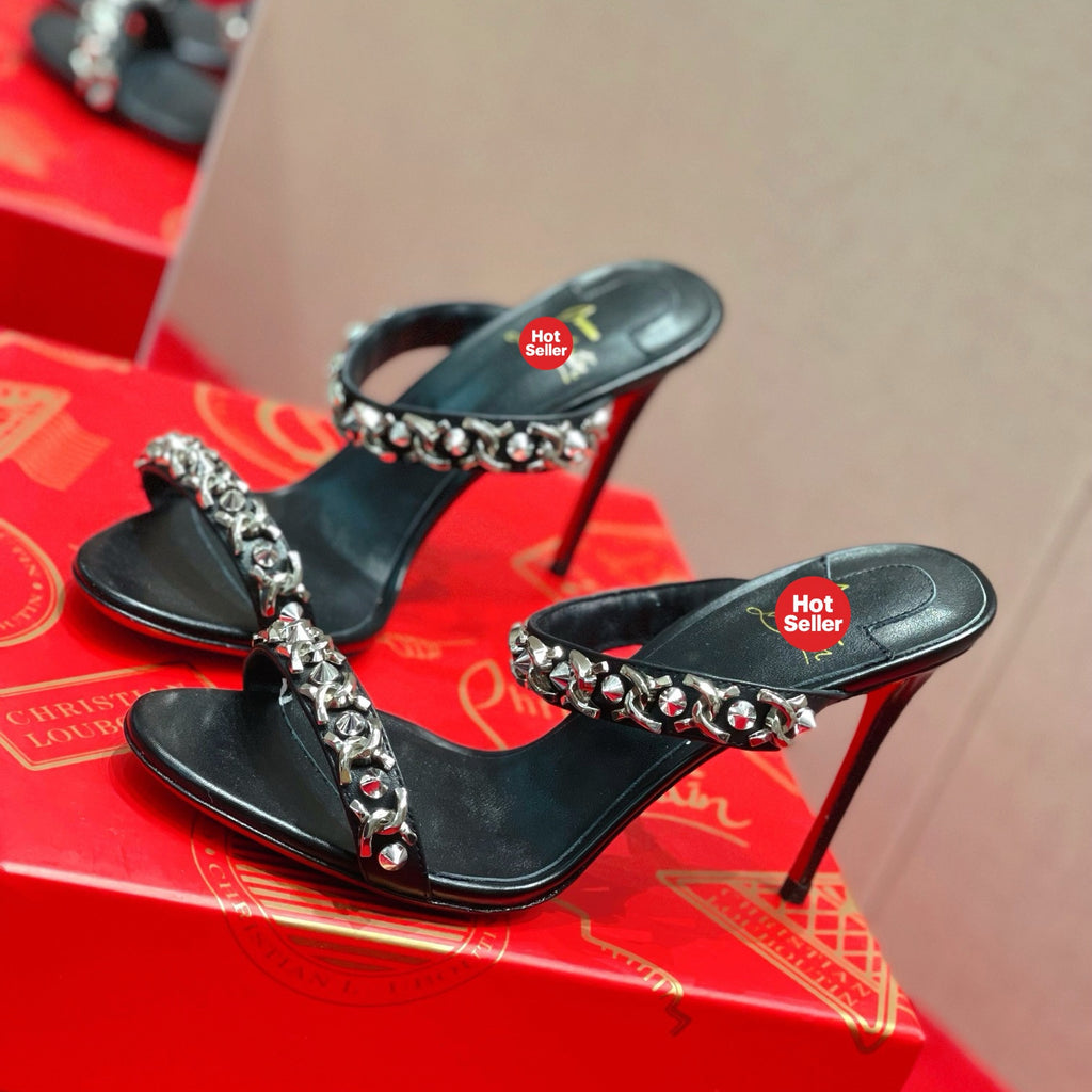 Chain-detail high-heeled mules, 10cm heel.