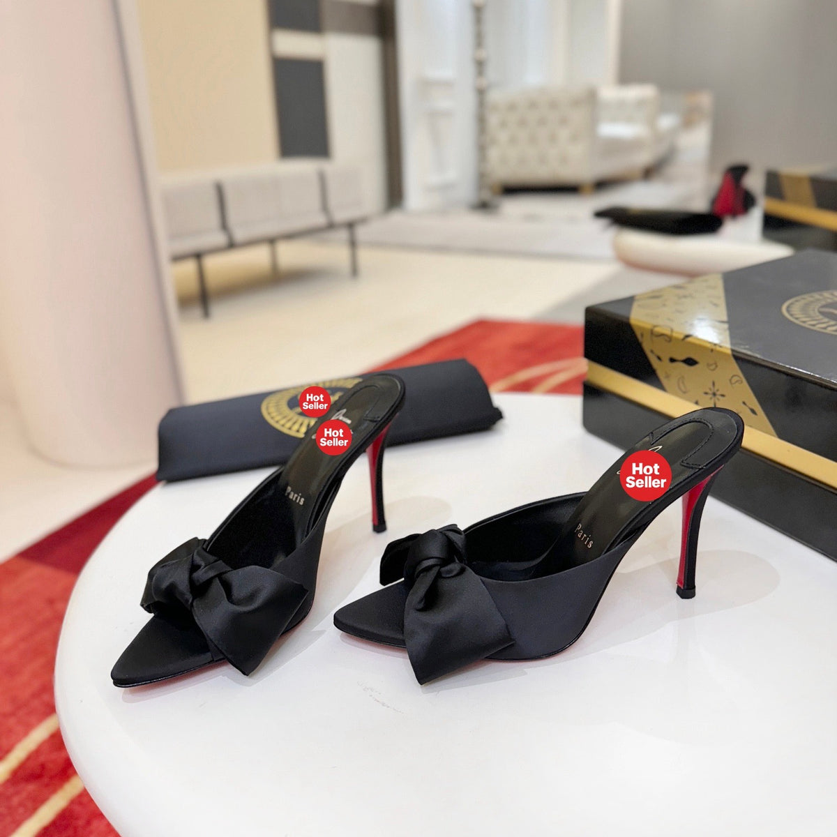 Black bow-detail high-heeled mules, 10cm heel.