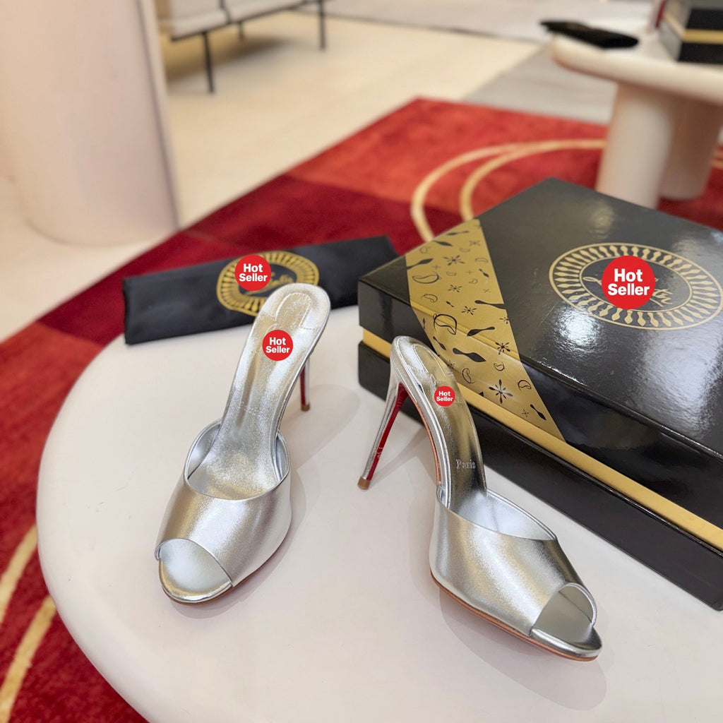 Silver peep-toe high-heeled mules, 10cm heel.
