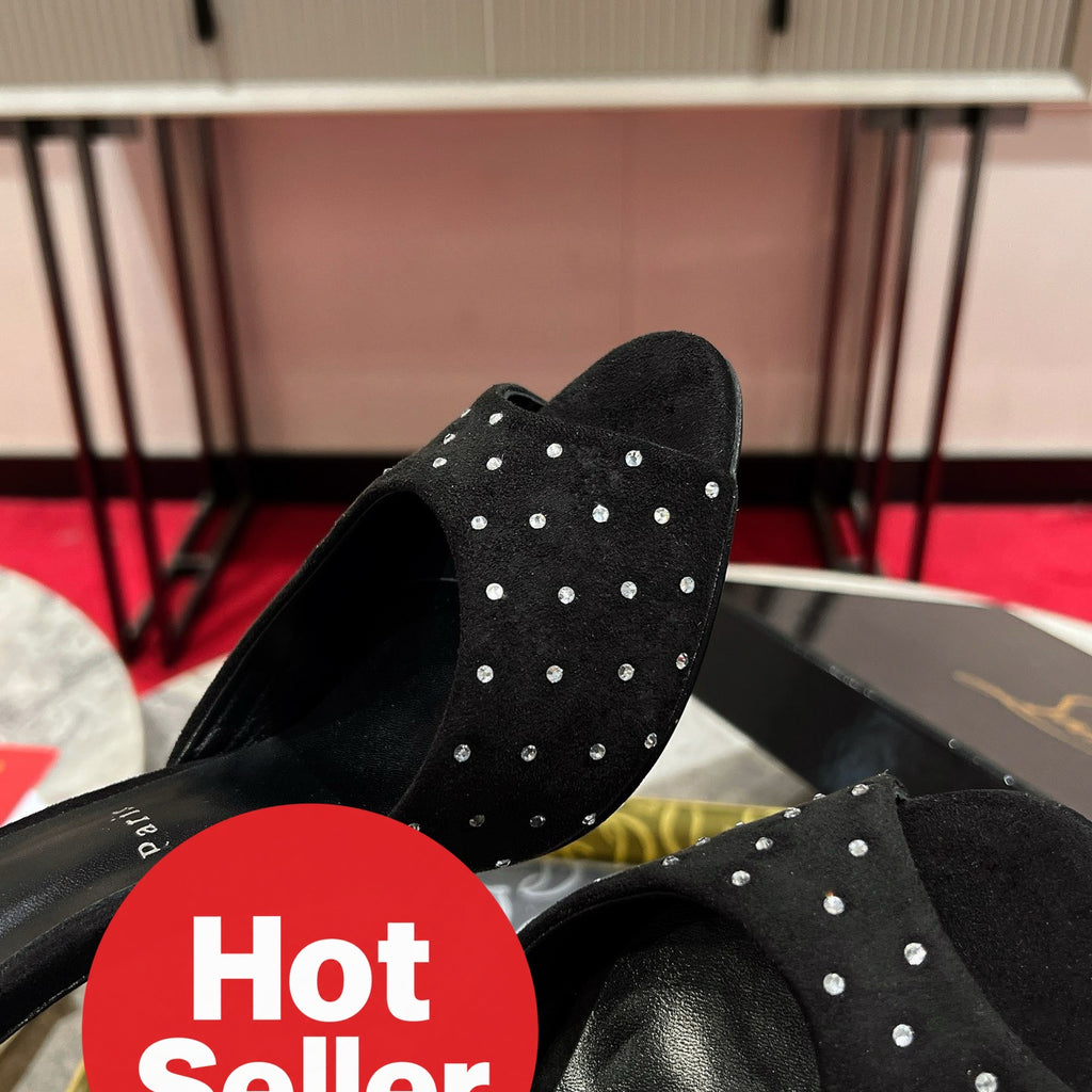 Black high-heeled mules with rhinestone accents, 10cm heel.