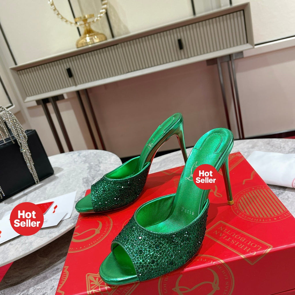 Green peep-toe high-heeled mules with rhinestone embellishment; 10cm heel.