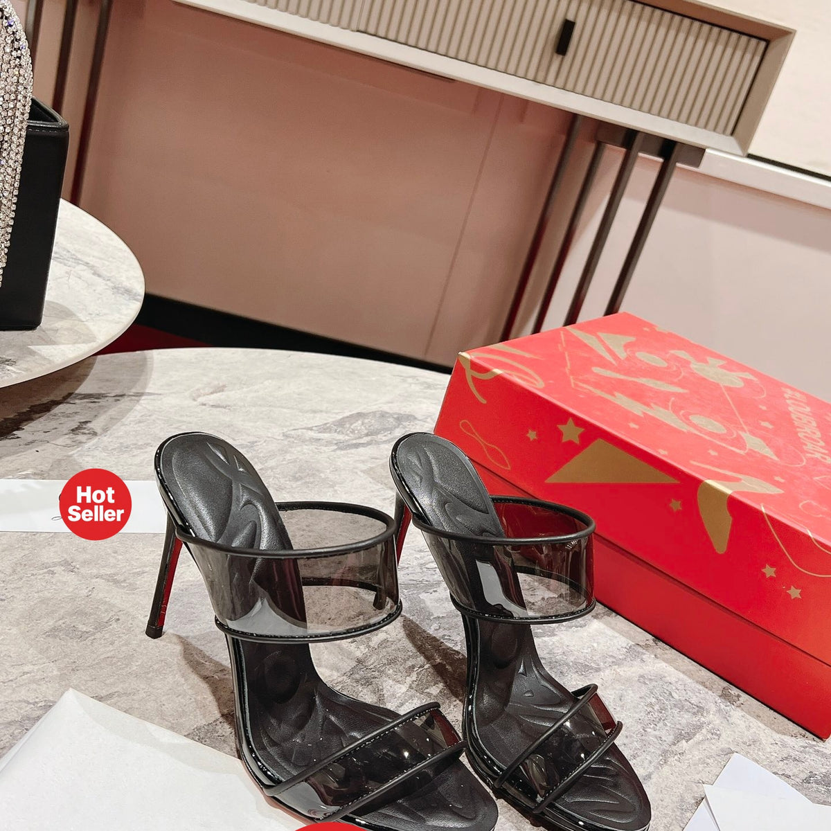 Black high-heeled mules, 10cm heel.