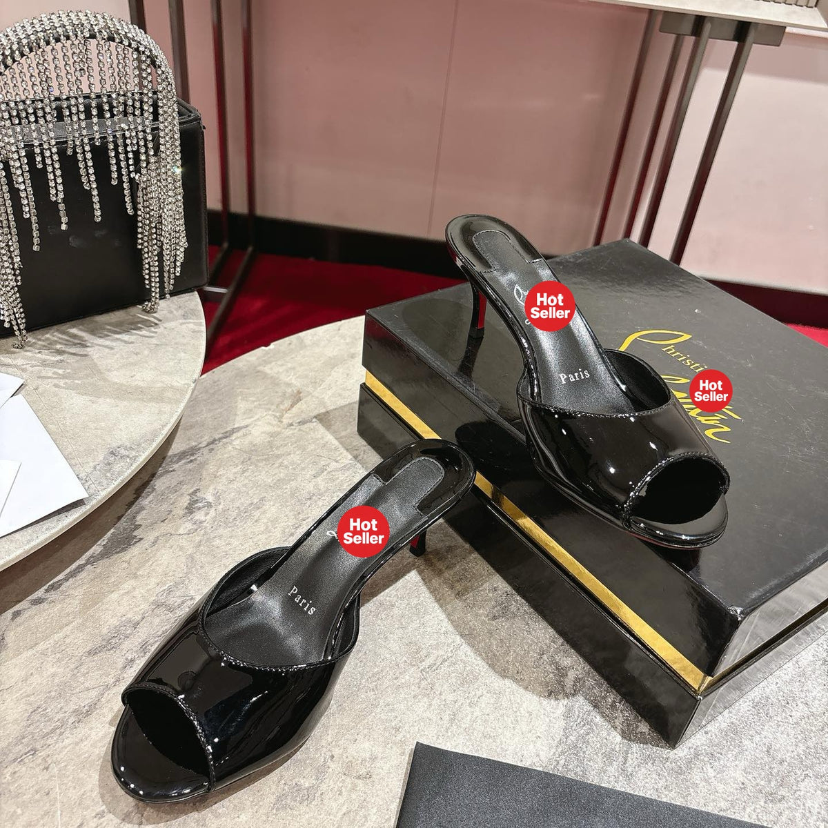 Black patent leather high-heeled mules, 8.5cm heel.
