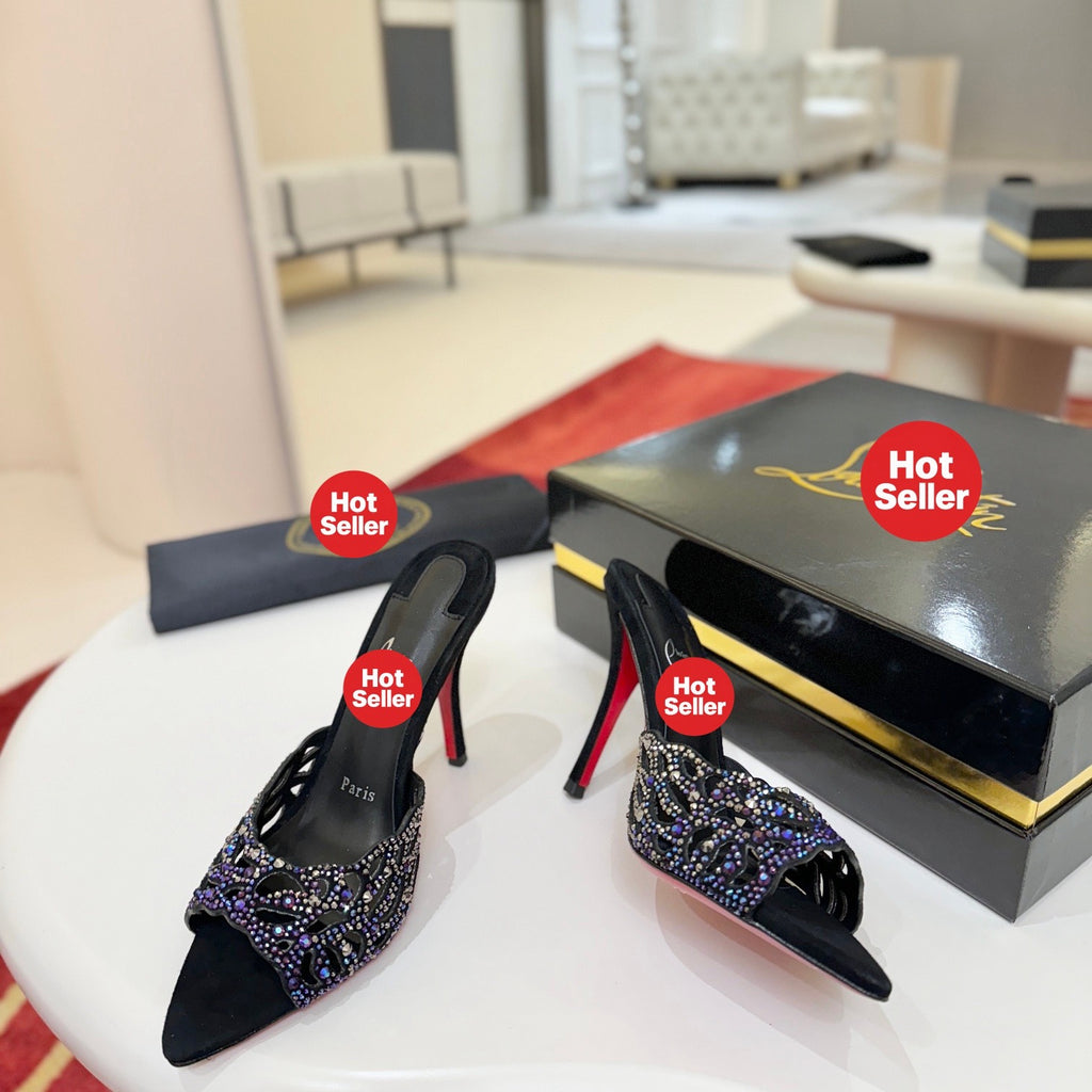 Black cutout high-heeled mules with all-over pavé crystals; 10cm heel.