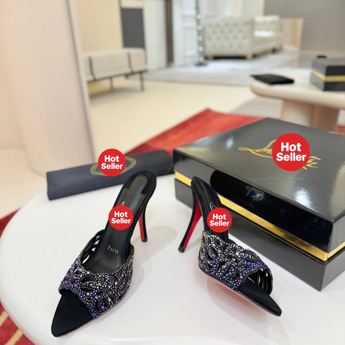 Black cutout high-heeled mules with all-over pavé crystals; 10cm heel.